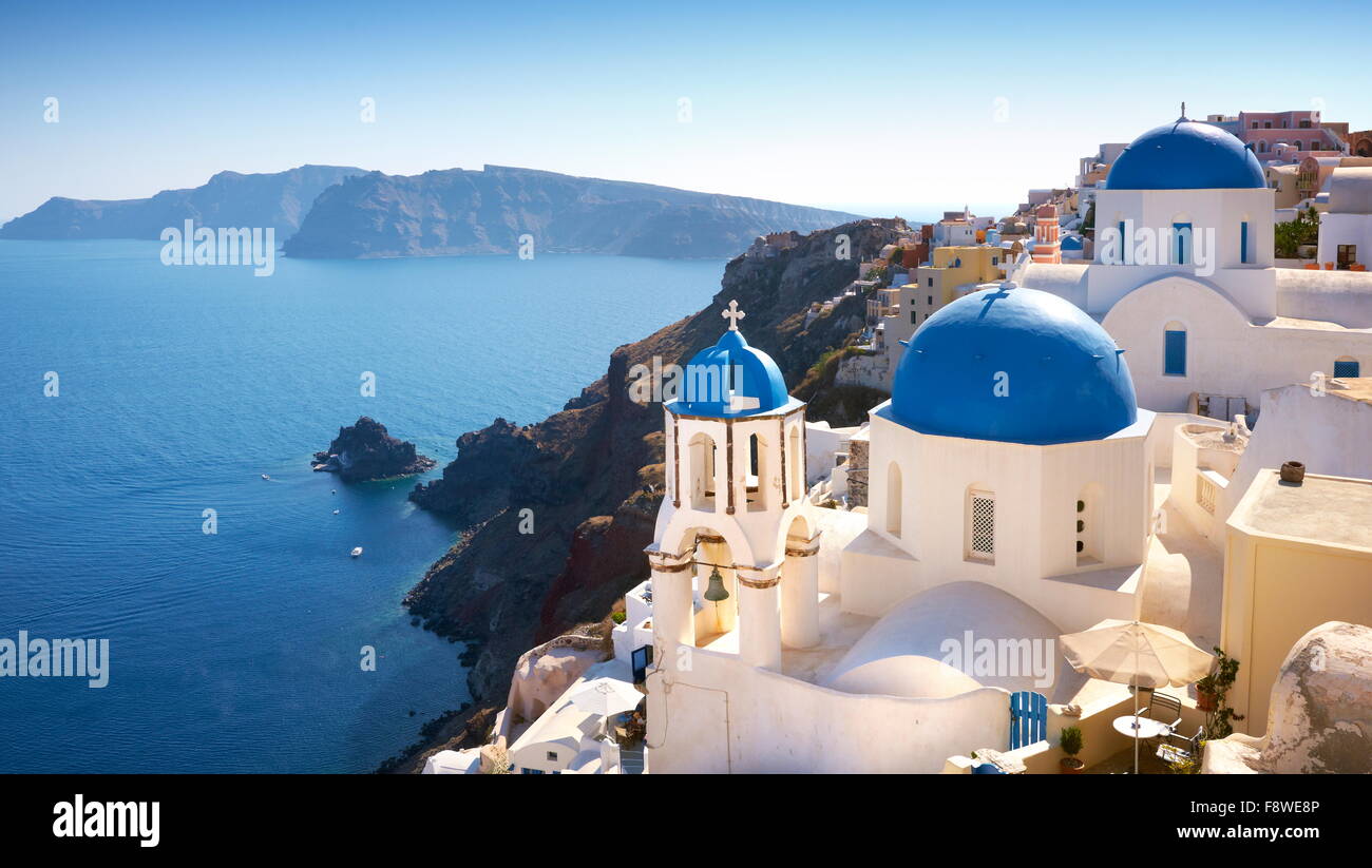 Santorini, Greece - white greek church with bell tower and sea in the background in Oia Town, Santorini Island, Cyclades Stock Photo