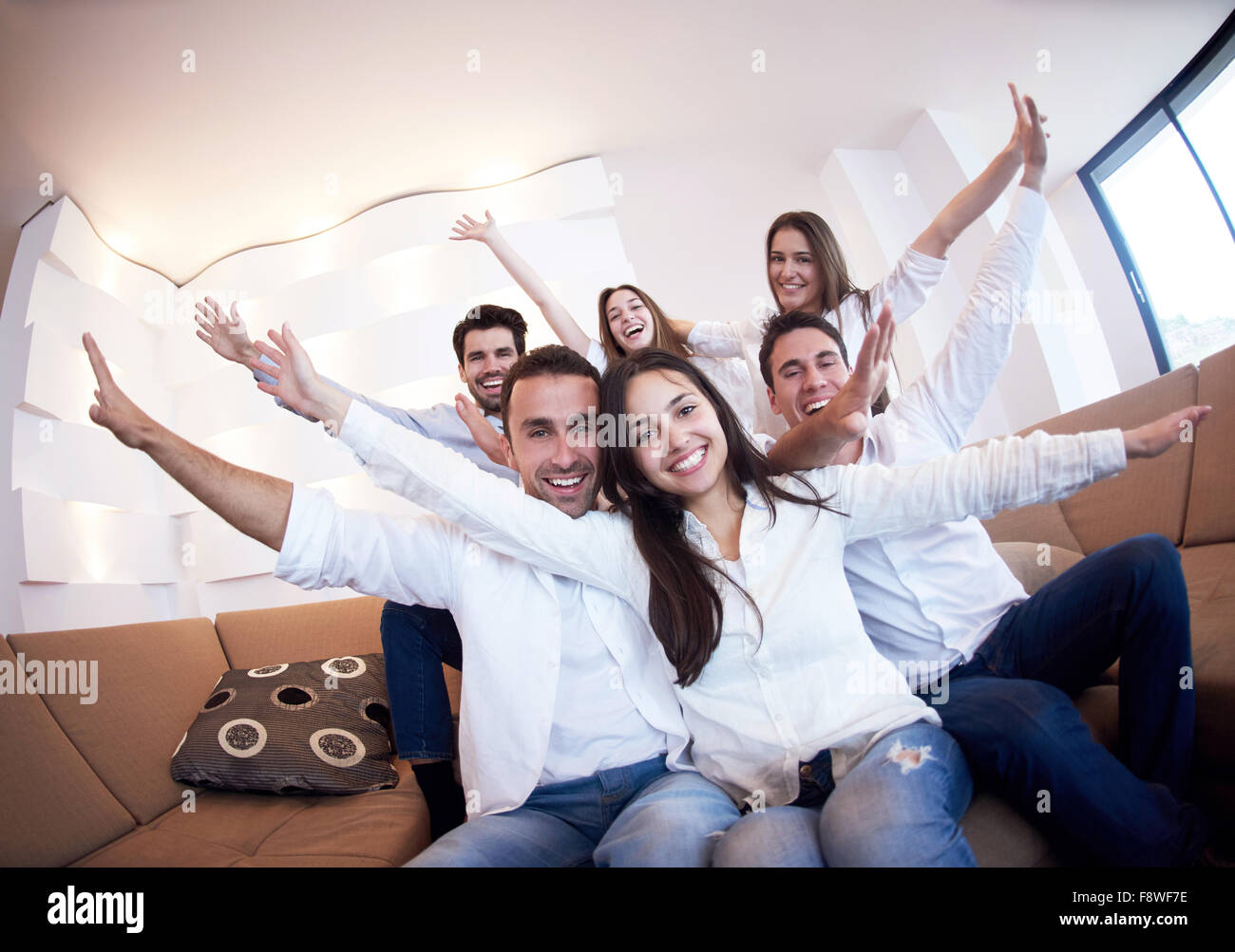 group of friends taking selfie photo with tablet at modern home indoors ...
