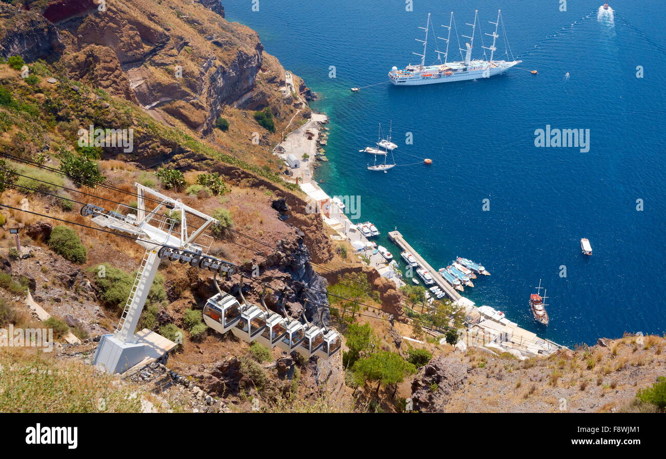 Cable car and harbour in Thira (Fira) - Santorini Island,  Cyclades Islands, Greece, Stock Photo