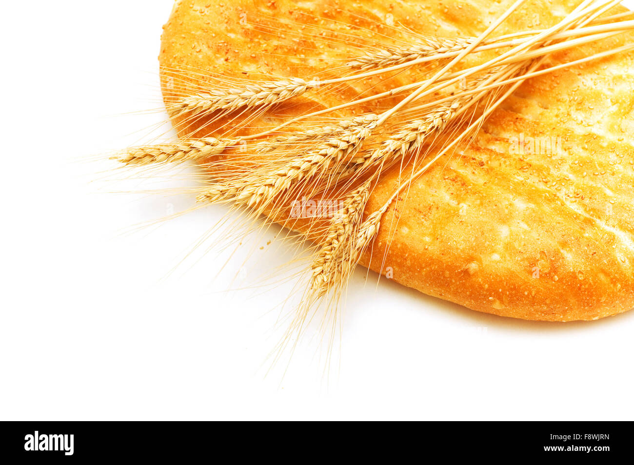 Bread and wheat ears isolated on white Stock Photo - Alamy