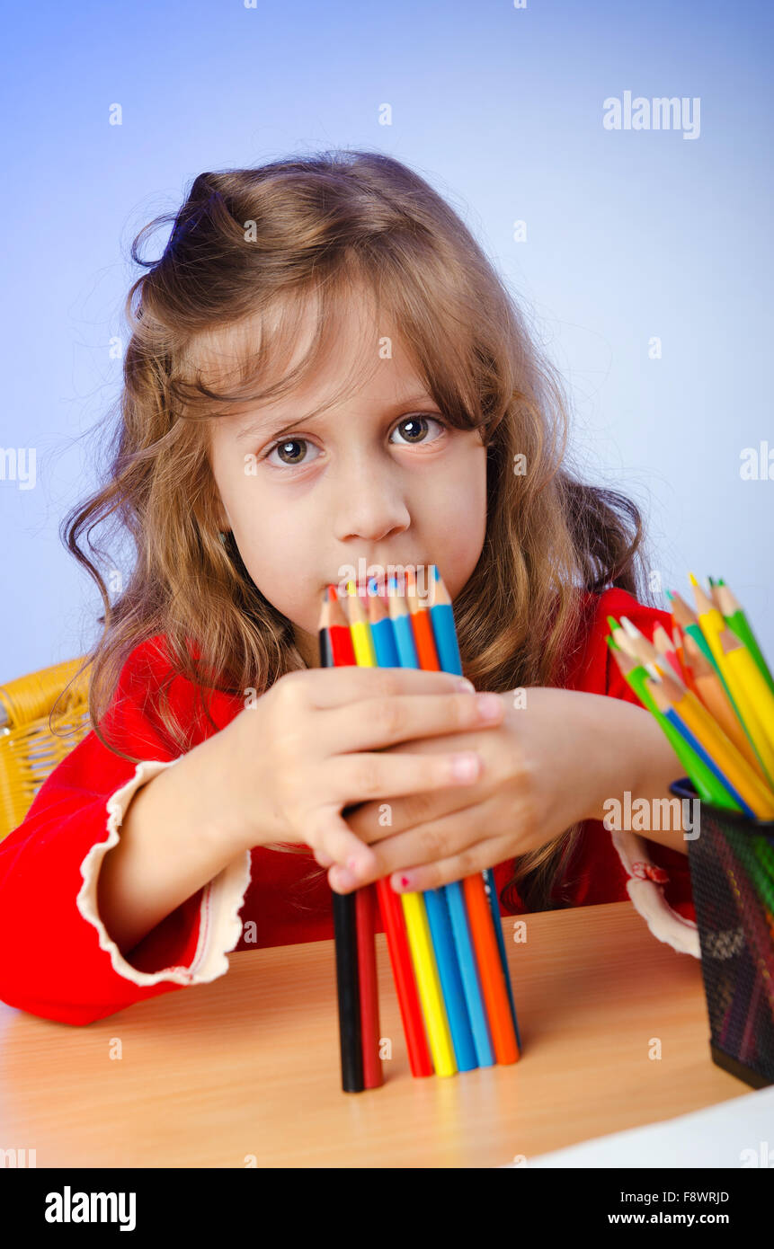 Little girl drawing with pencils Stock Photo - Alamy