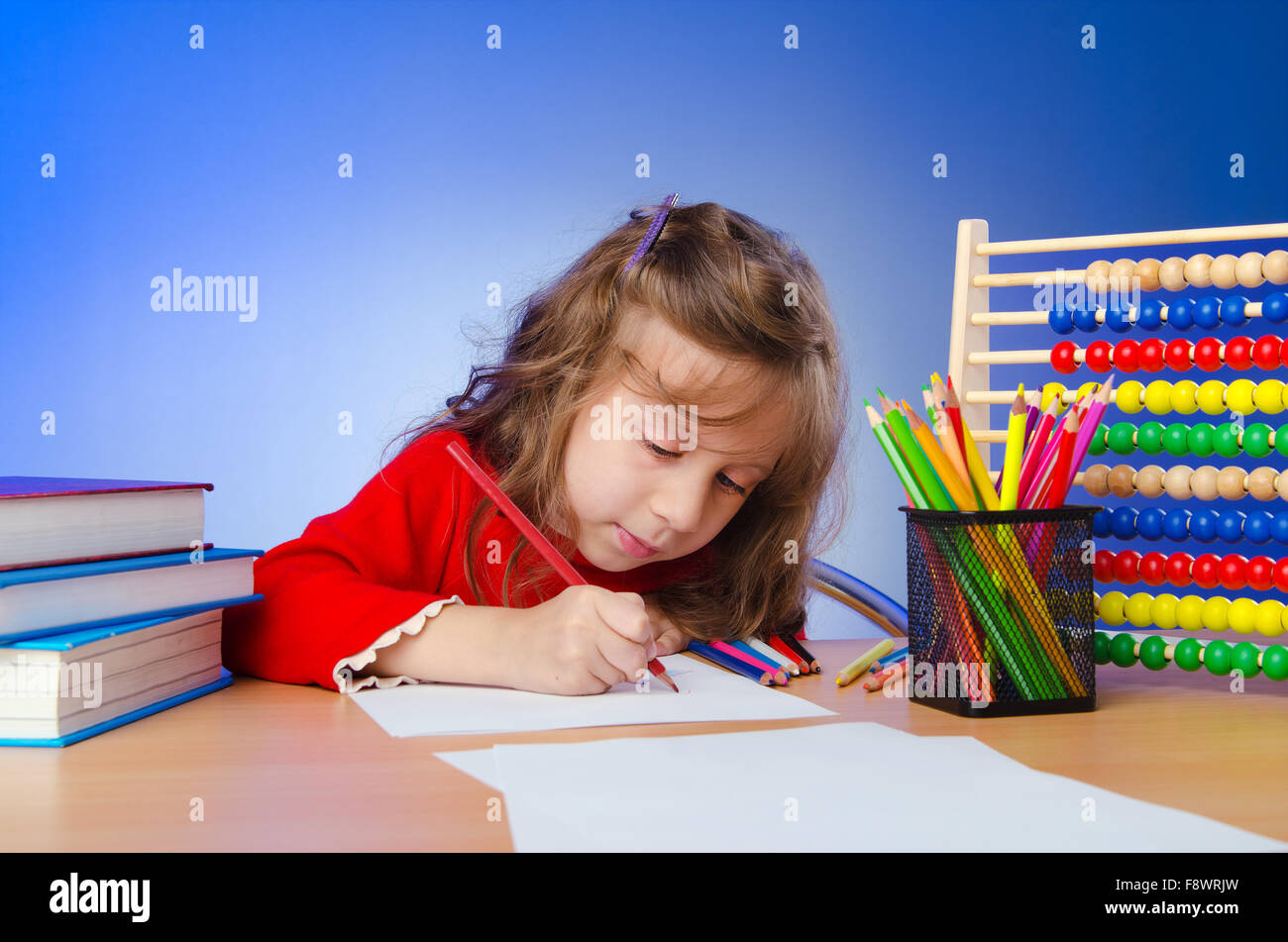 Little girl drawing with pencils Stock Photo - Alamy