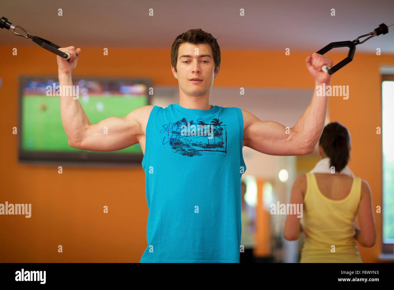 Man Weight Training At Gym Stock Photo - Alamy