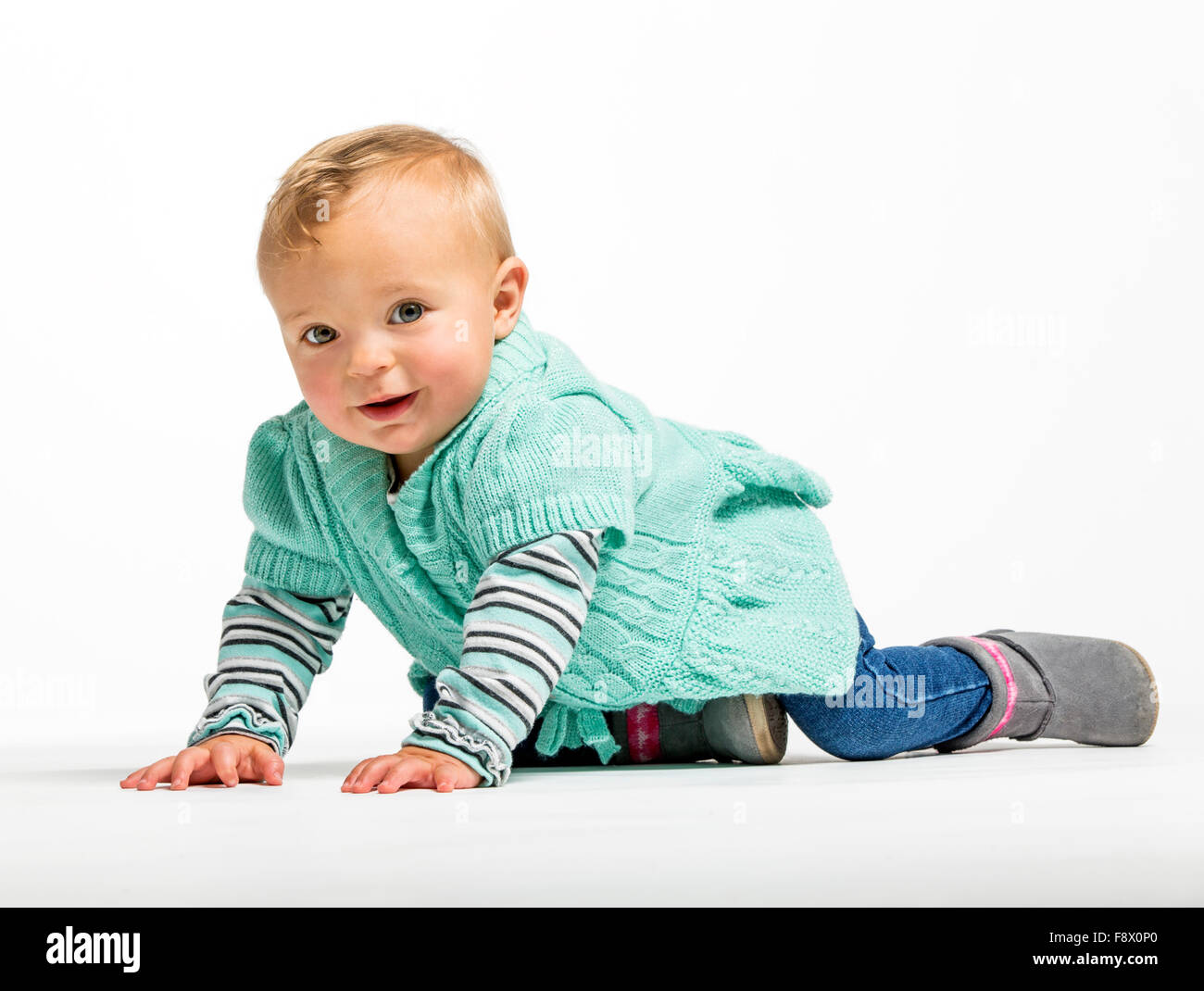 Studio photograph of cute smiling one year old baby girl Stock Photo