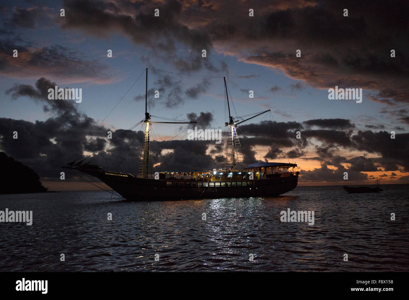 Sailing Yacht, the Fiji Siren, a liveaboard dive boat at anchorage at sunset. Stock Photo
