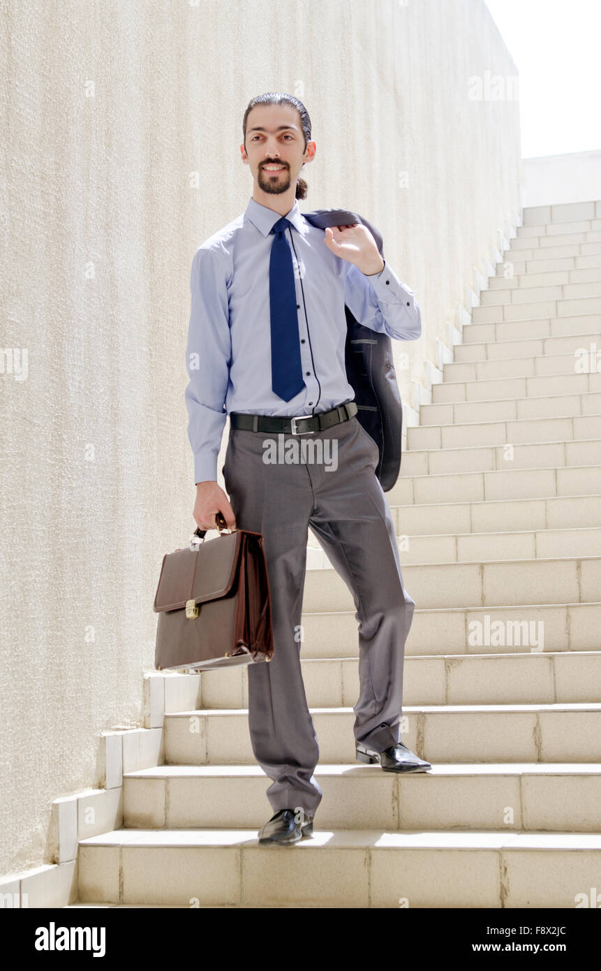 Young businessman running up stairs hi-res stock photography and images ...