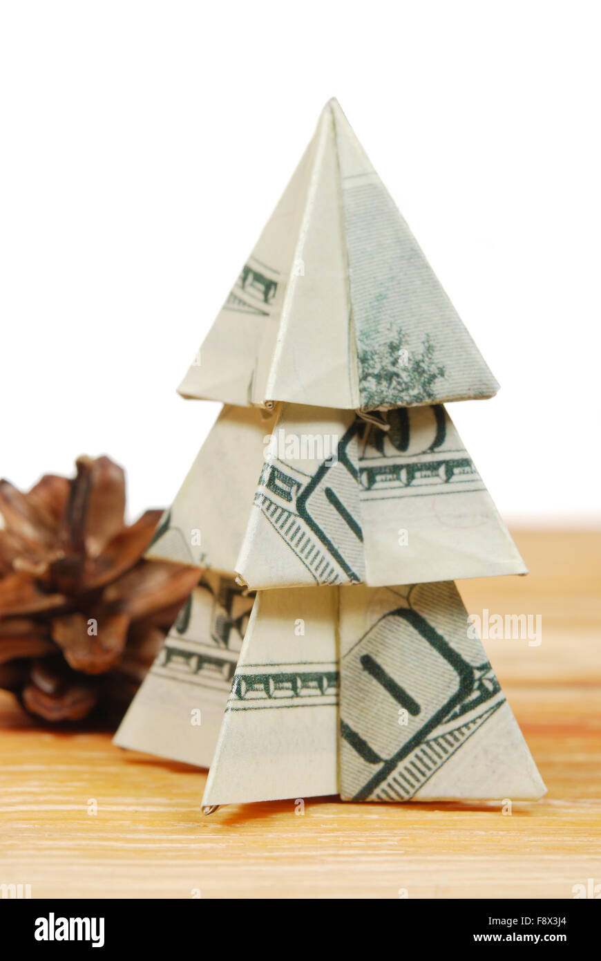 Christmas Tree Made Of Hundred Dollar Bills On A Wooden