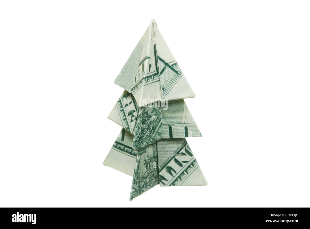 Christmas tree made of hundred dollar bills on a white background Stock