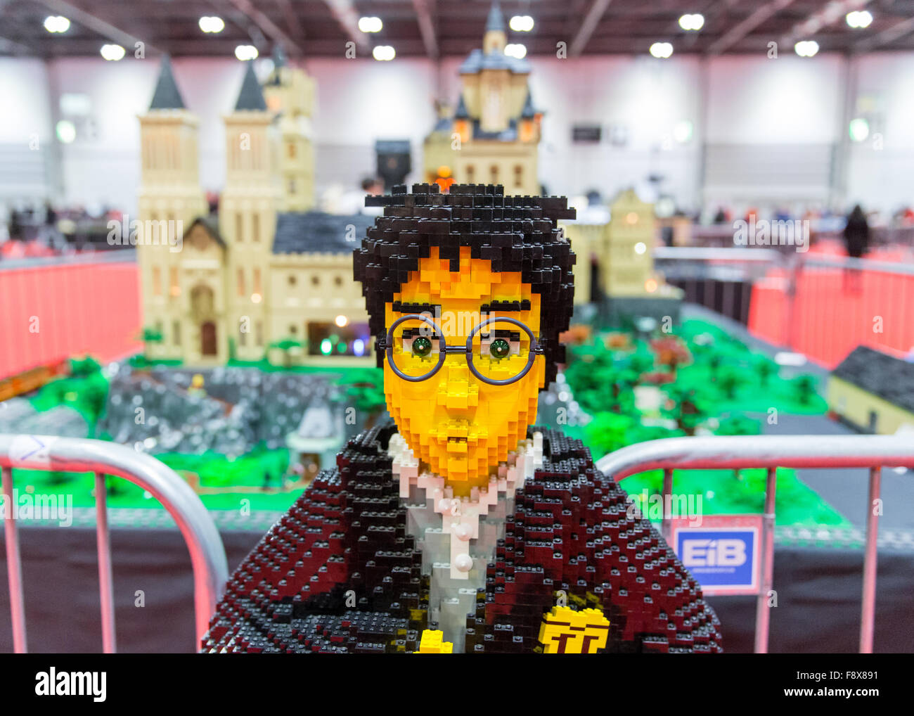 ExCel, London, UK, 11th December, 2015. Brick Lego Expo 2015 is an  exhibition dedicated to Lego which runs for three days. Harry Potter model  in front of Hogwarts model. Copyright Carol Moir/Alamy