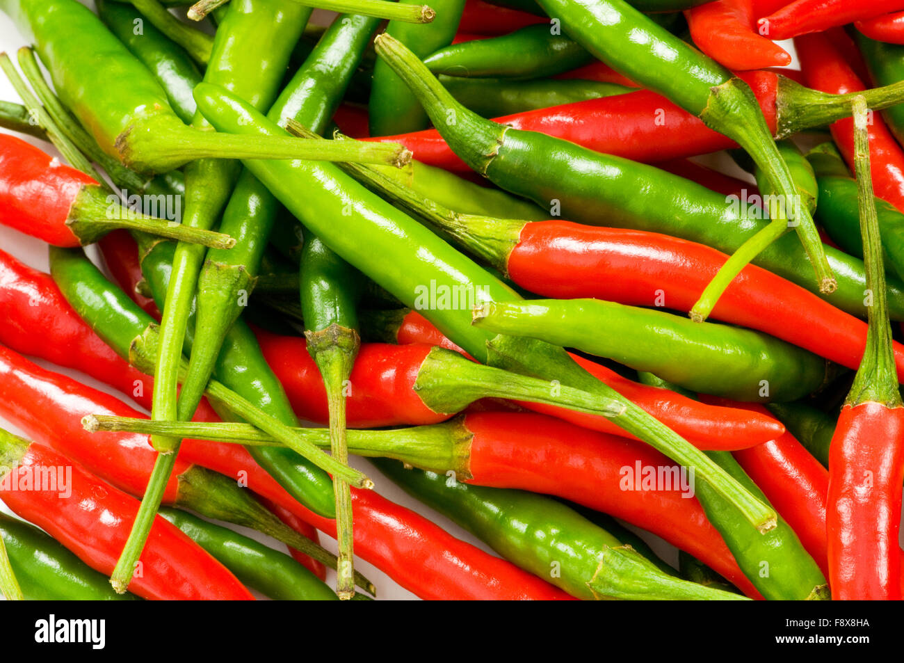Red and green chili peppers at the background Stock Photo - Alamy