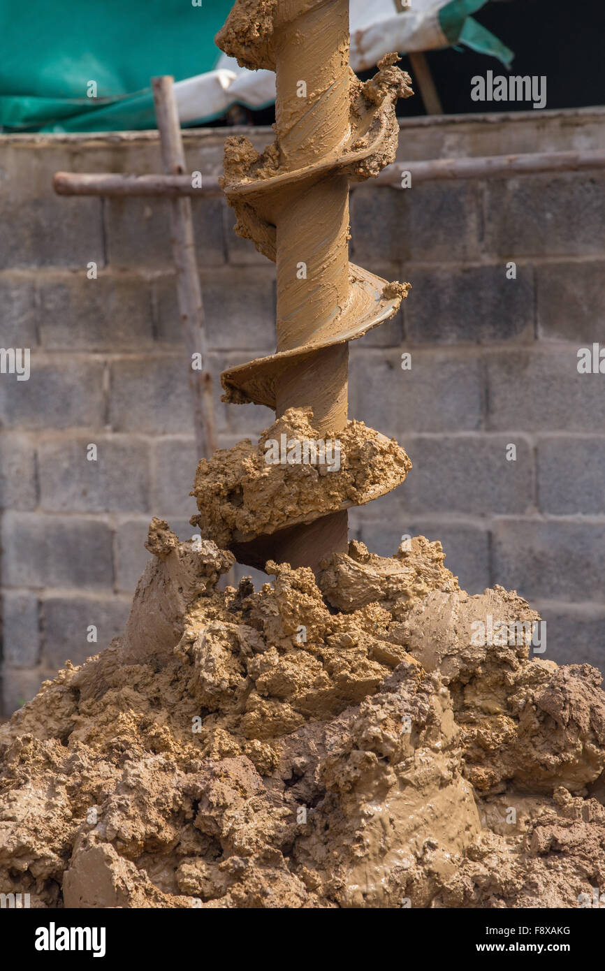 machine for drilling holes in the ground at construction site Stock