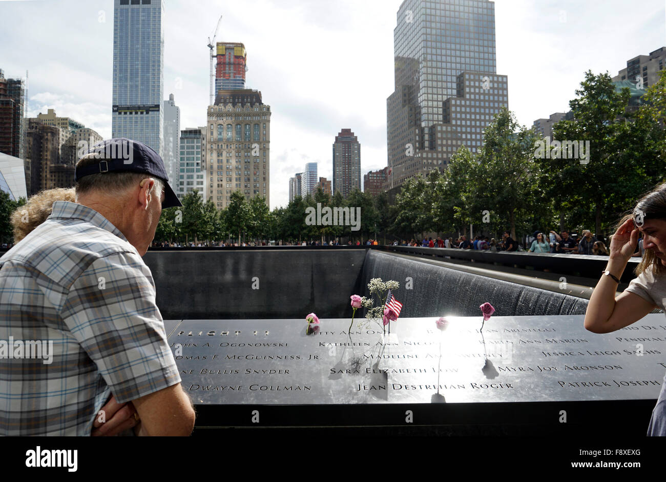 Visitors at the National 9/11 memorial, Lower Manhattan, New York City, USA Stock Photo