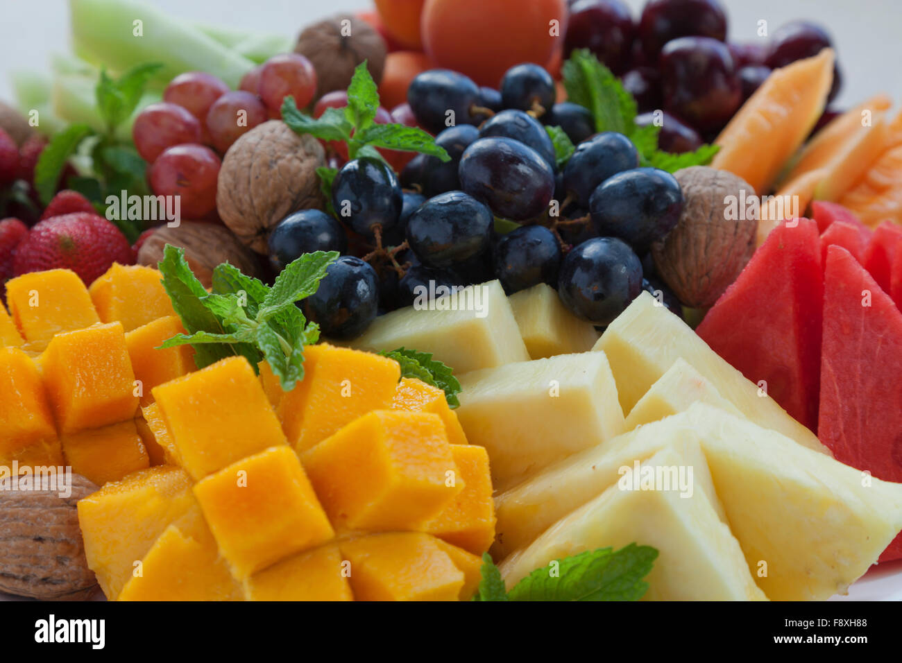 Colourful summer fruit platter with mango, pineapple, watermelon