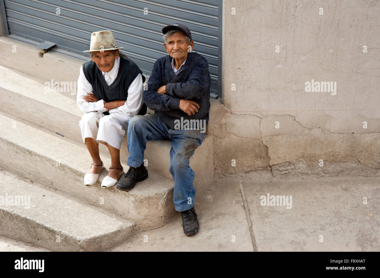 Elderly man watching passing train en route to  Salinas from Ibarra, Ecuador Stock Photo