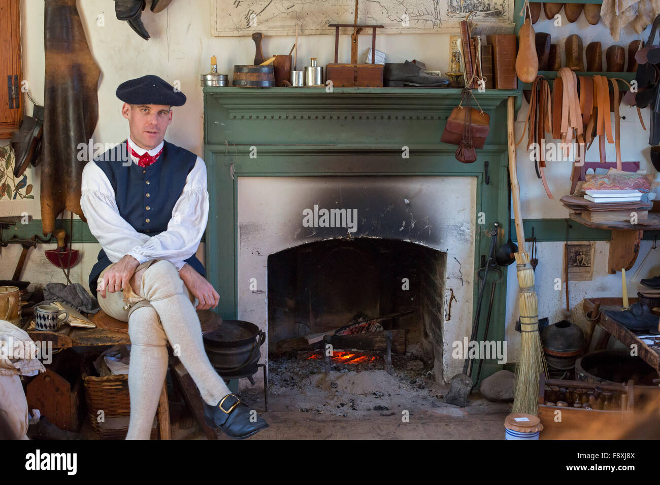 Williamsburg, Virginia - A shoemaker in his shop at Colonial Williamsburg. Stock Photo