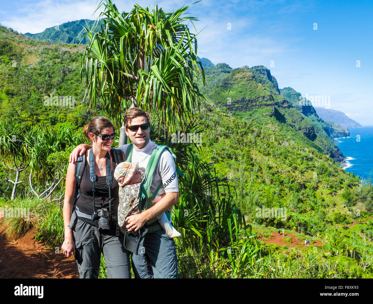 Hikers with baby on the Kalalau Trail Stock Photo