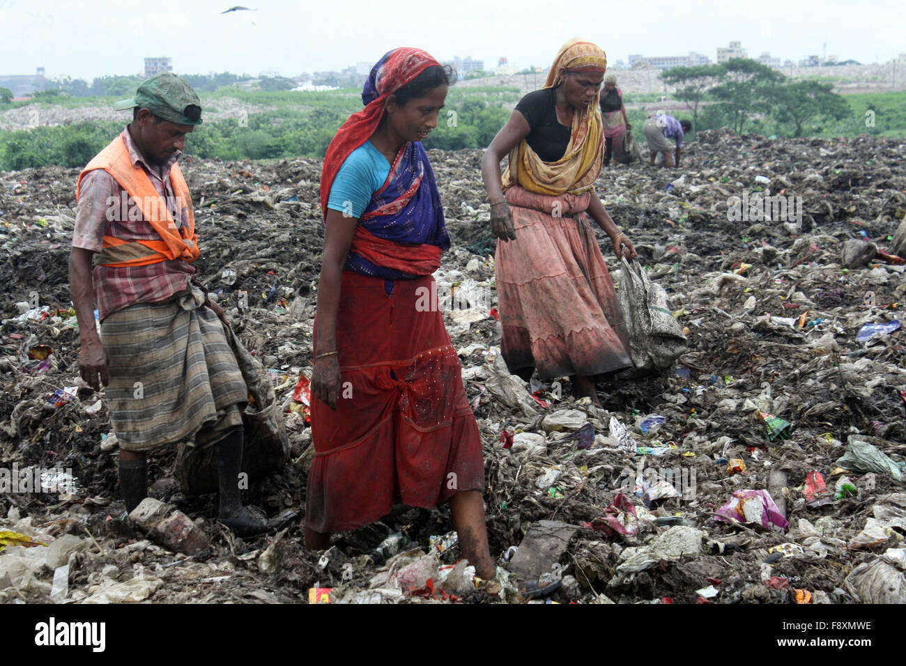 Male and Female waste pickers pick the non biodegradable waste to be