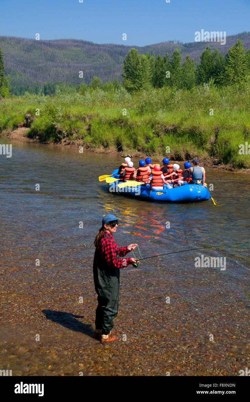 Rafting on Moccasin Creek with flyfisherman, Middle Fork Flathead Wild and Scenic River, Flathead National Forest, Montana Stock Photo