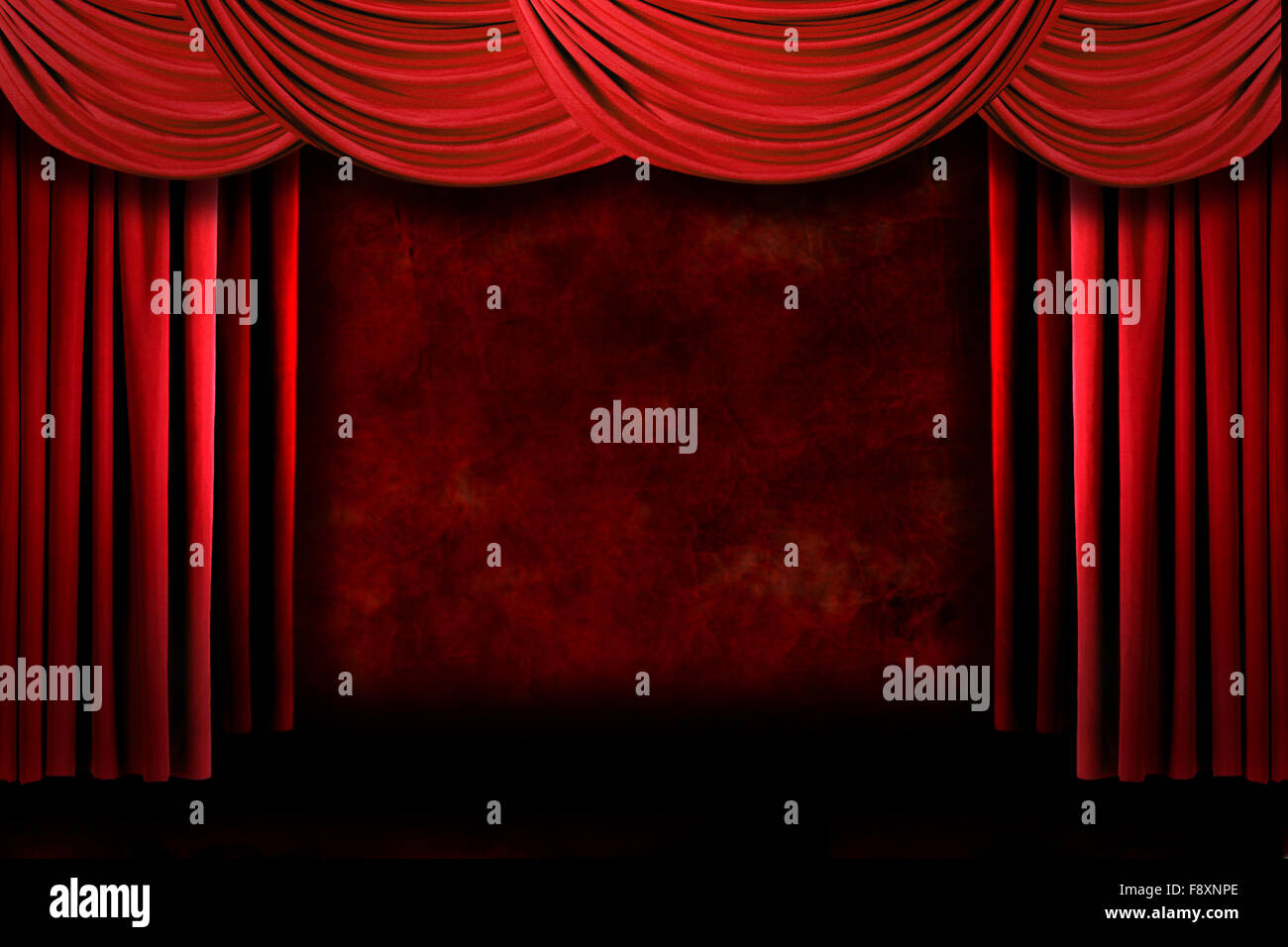 Red Grungy Stage Theater Drapes With Dramatic Lighting Stock Photo