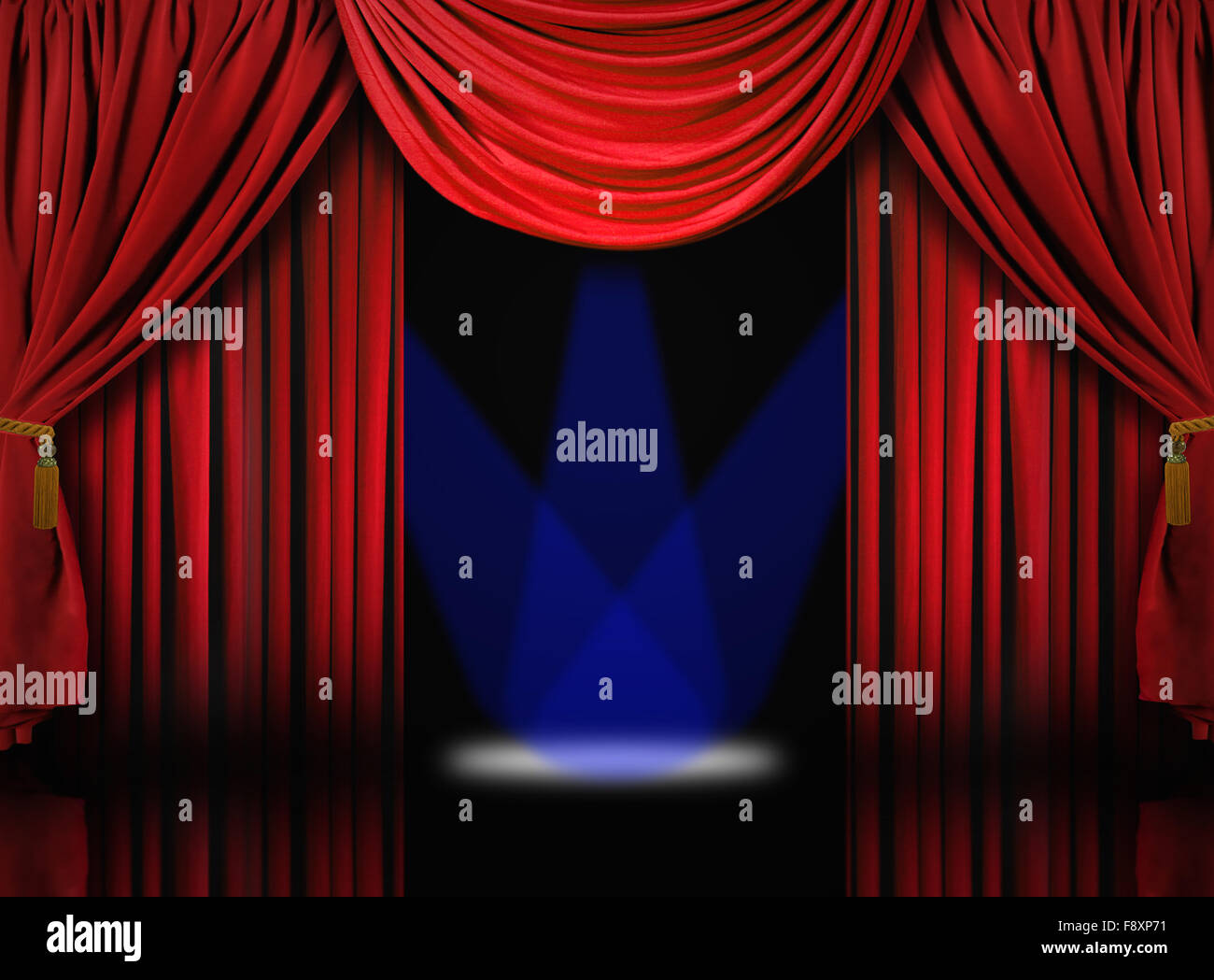 Velvet Theater Stage Drape Curtains With Blue Spotlights Stock Photo