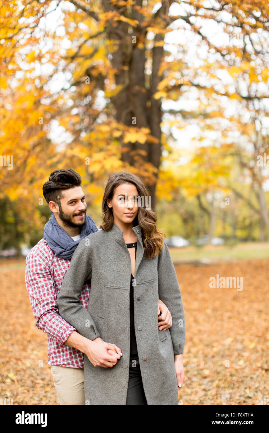 Young couple in the autumn park Stock Photo - Alamy