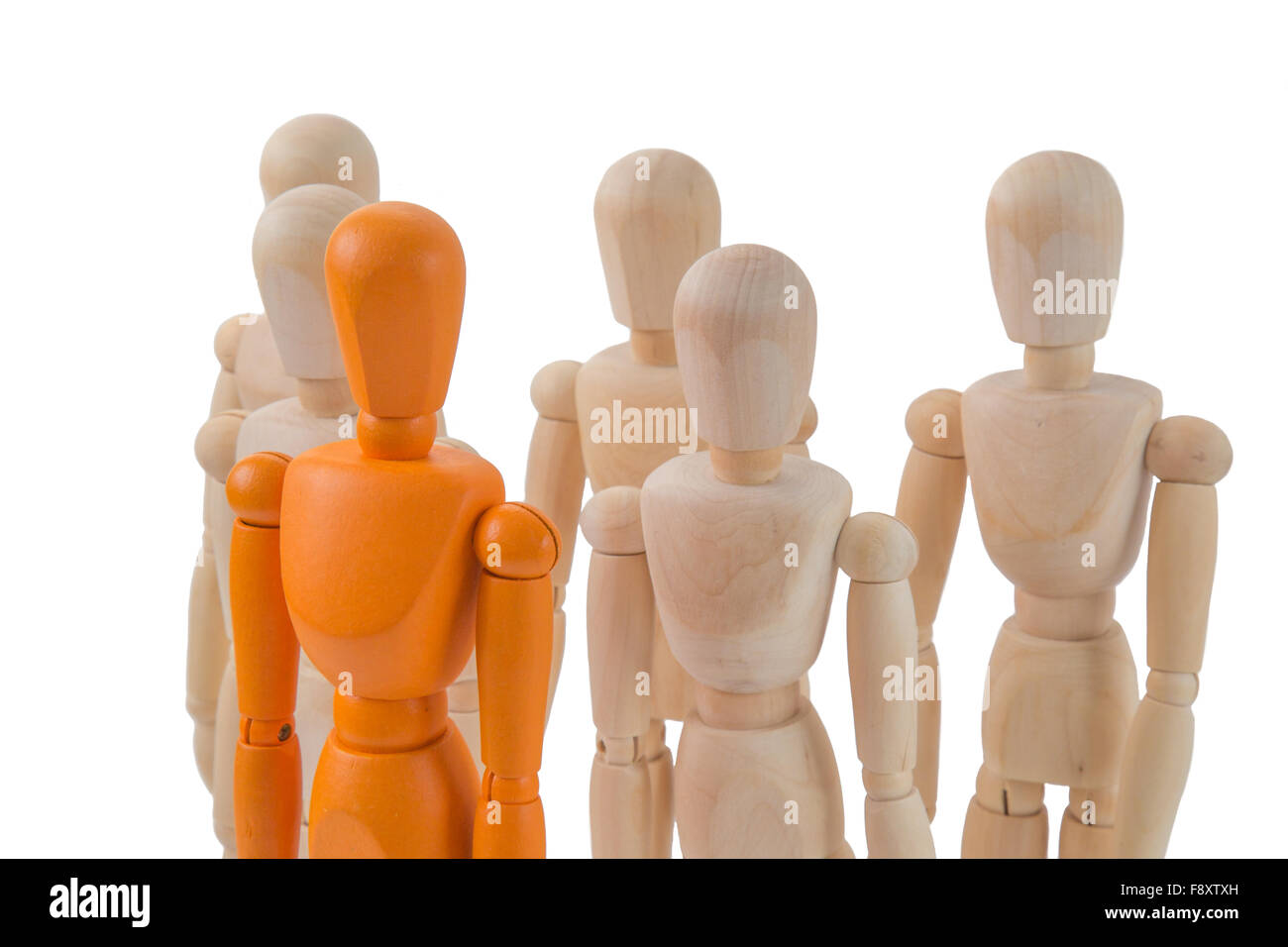 Stand out from the crowd concept with one single orange person  among a lot of others Stock Photo