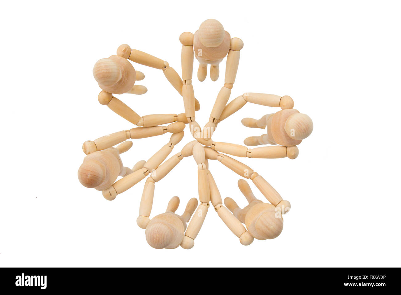 Group of puppets from above in a circle with hands together Stock Photo