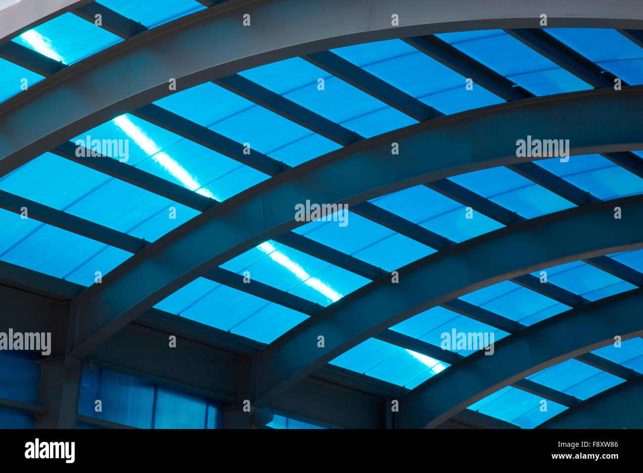 Blue shiny roof with sunny line and steel construction Stock Photo