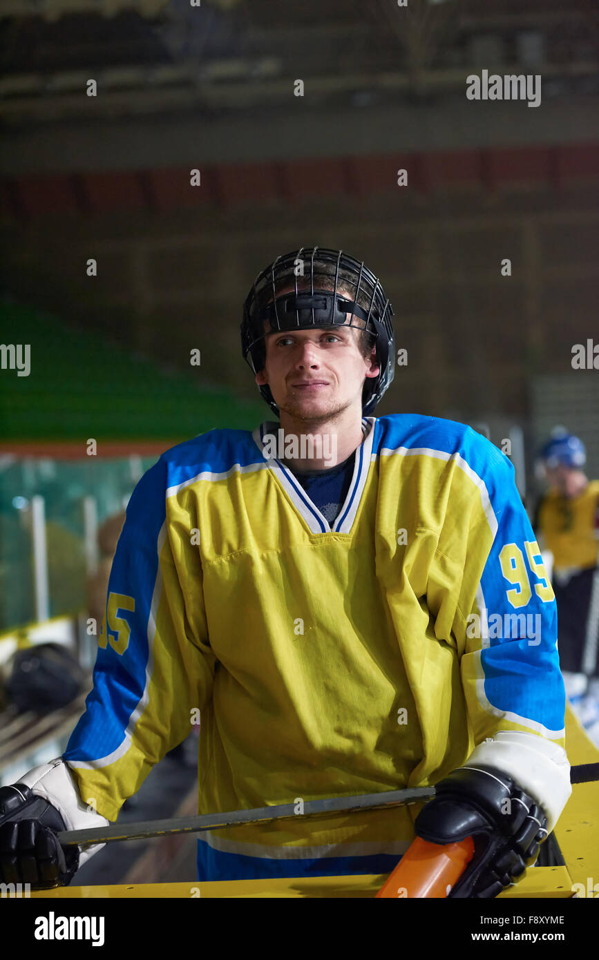 young ice hockey player portrait on training in black background Stock