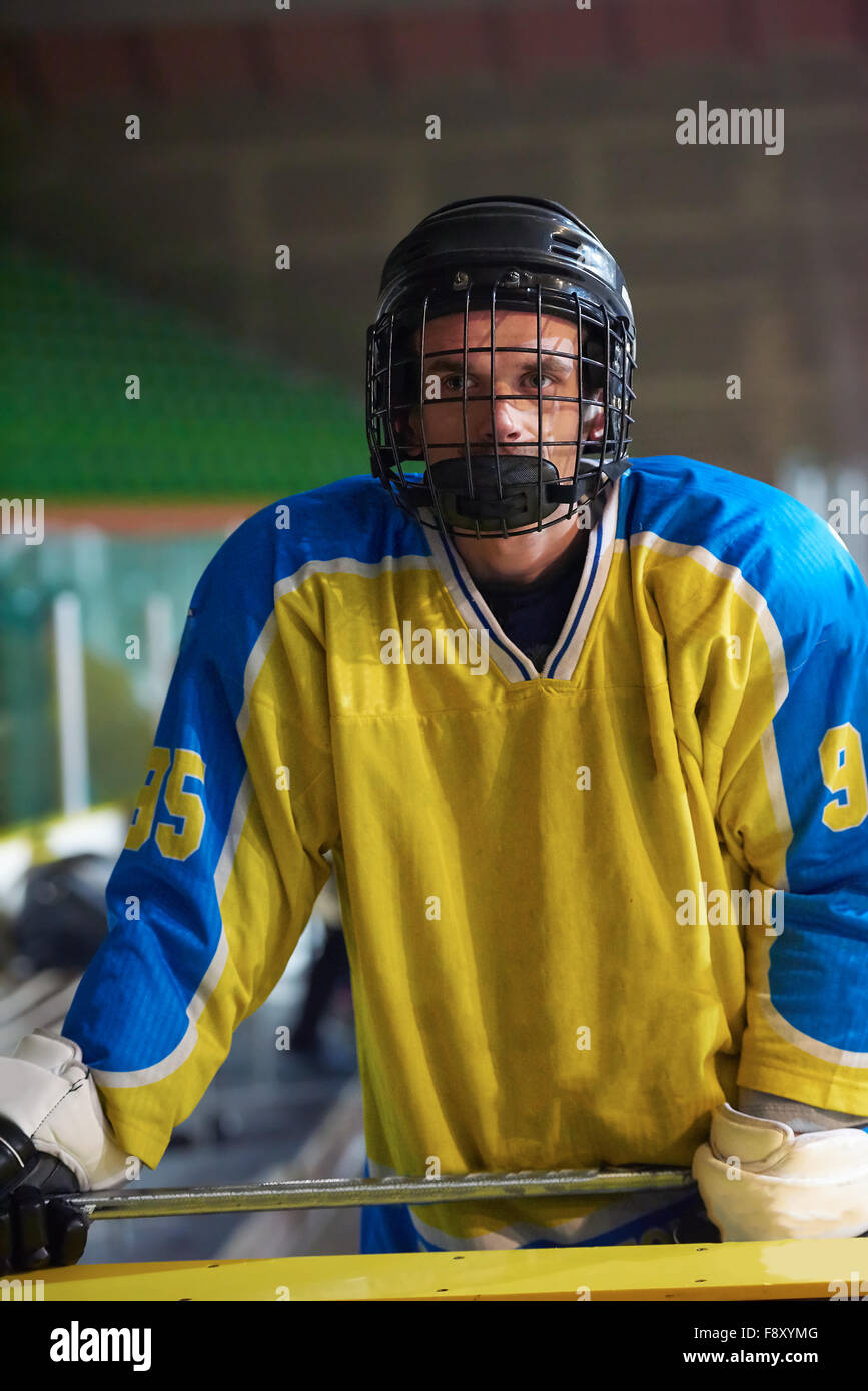 young ice hockey player portrait on training in black background Stock