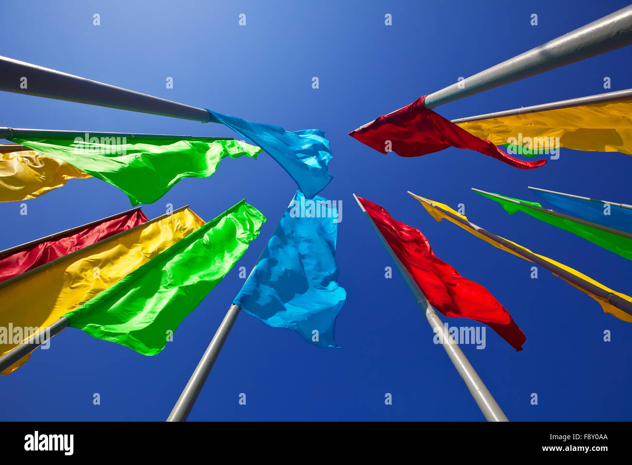 Colourful flags against the blue sky Stock Photo - Alamy