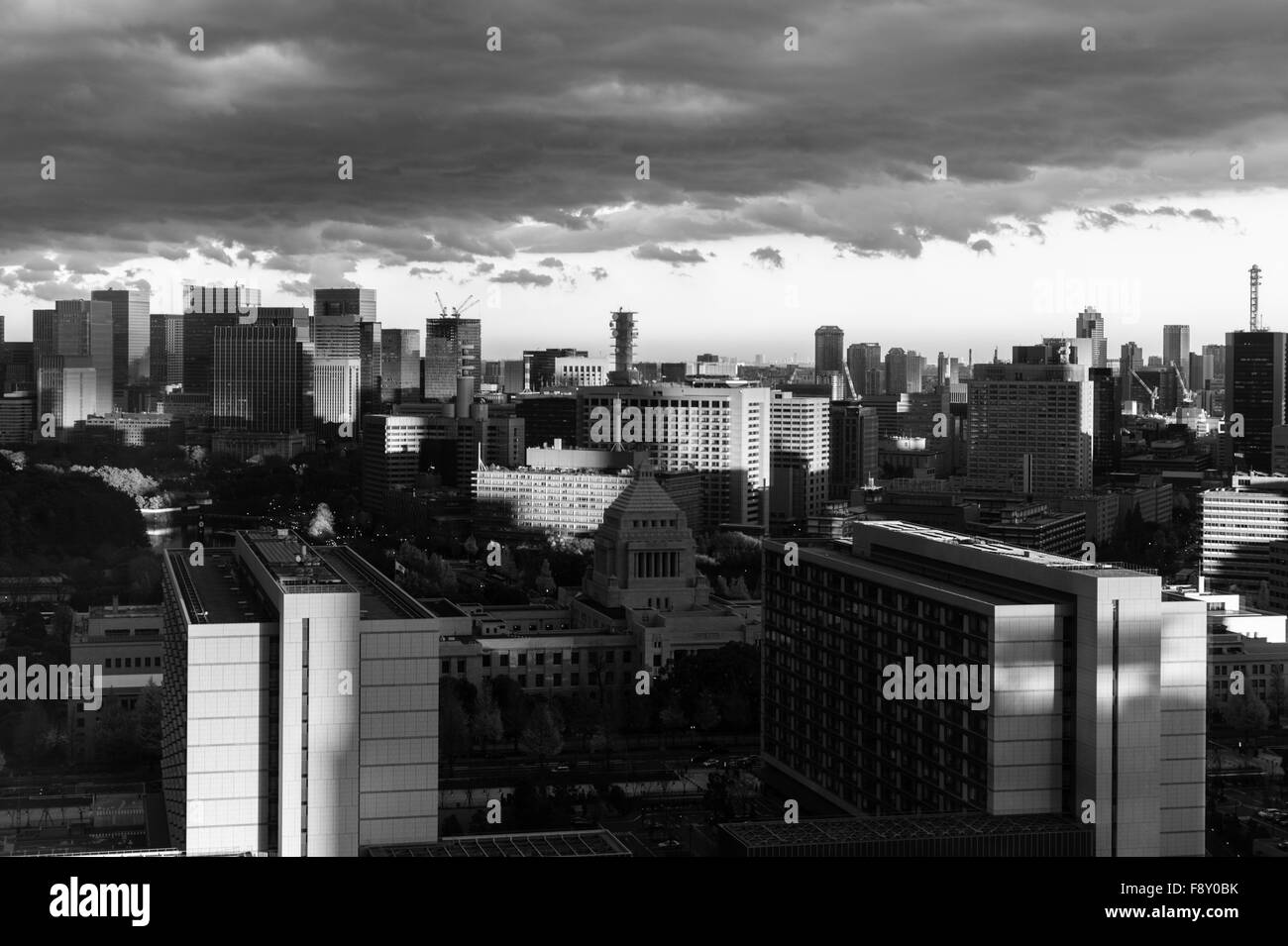 Shadows over the parliament or diet building (kokaigijido) under a stormy sky in Tokyo Stock Photo