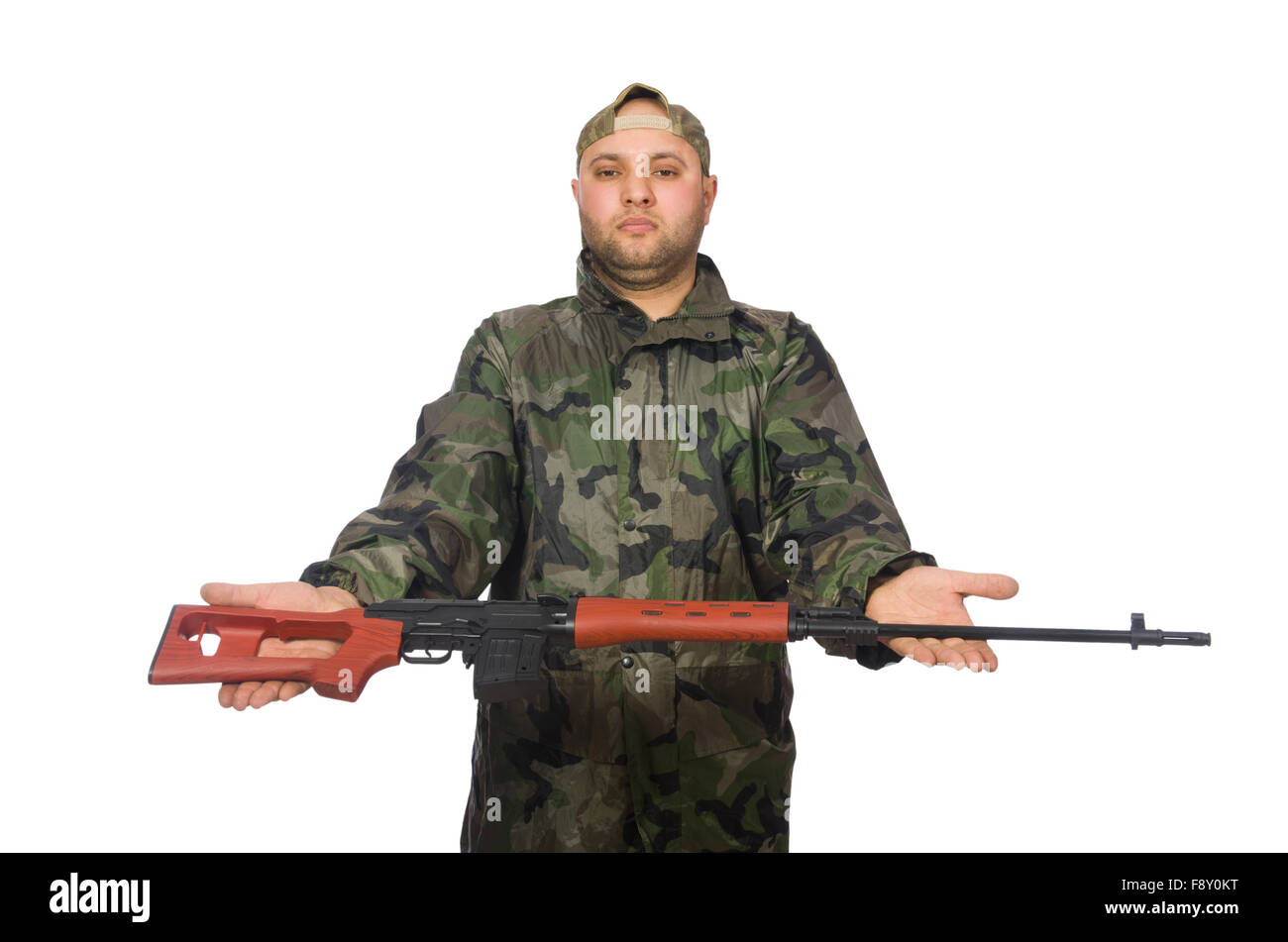 Young man in soldier uniform holding gun isolated on white Stock Photo ...