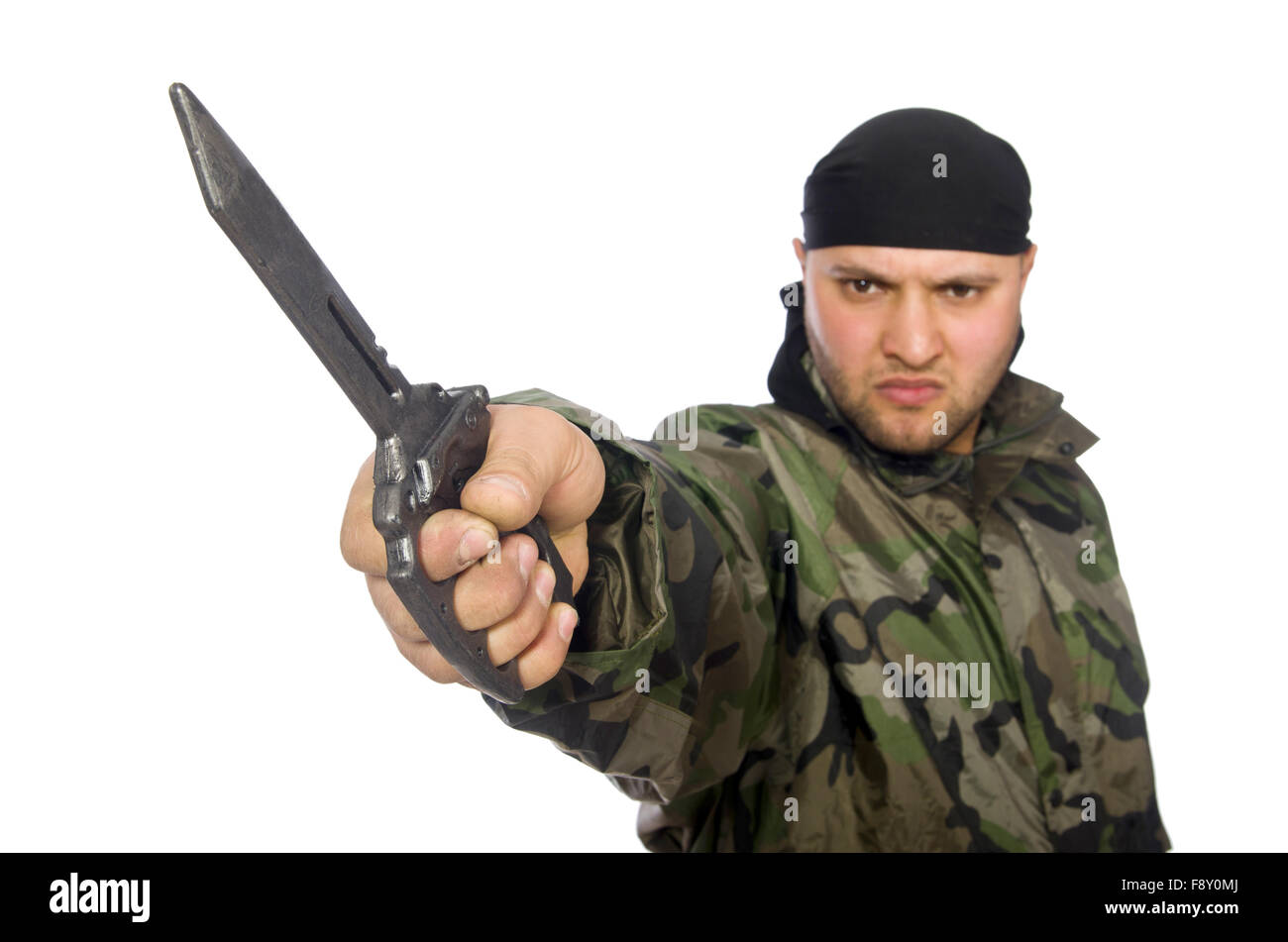Young man in soldier uniform holding knife isolated on white Stock