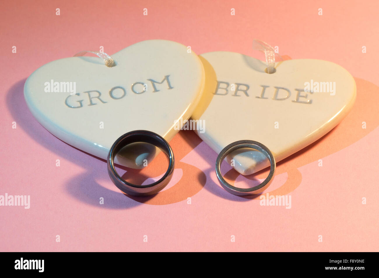 Two hearts bearing the inscription bride and groom and two wedding