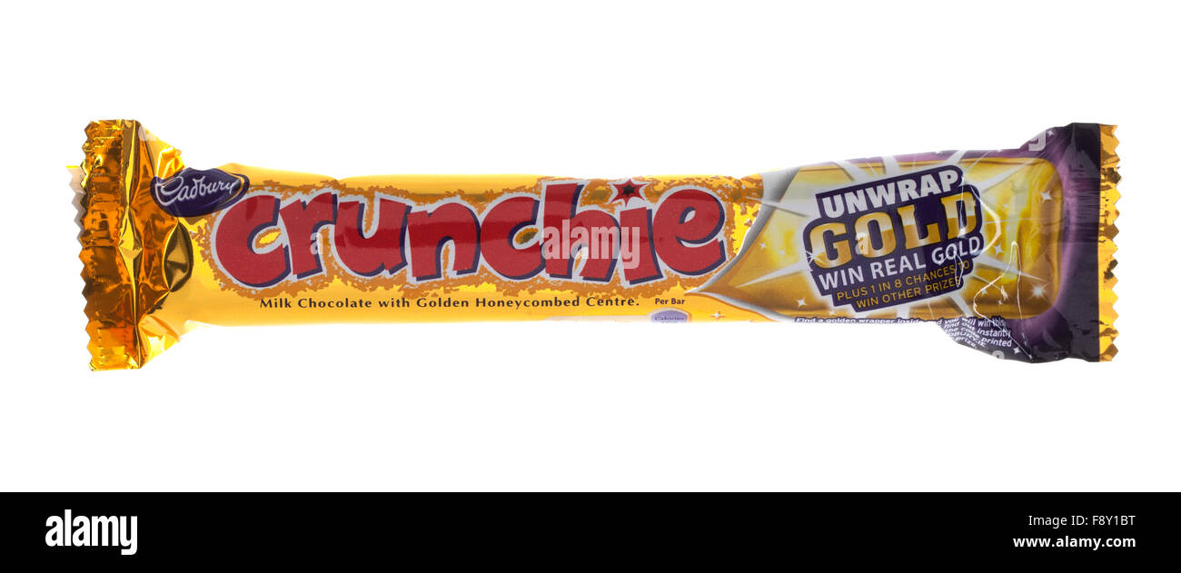 Cadbury's Crunchie Chocolate bar on a white background Stock Photo