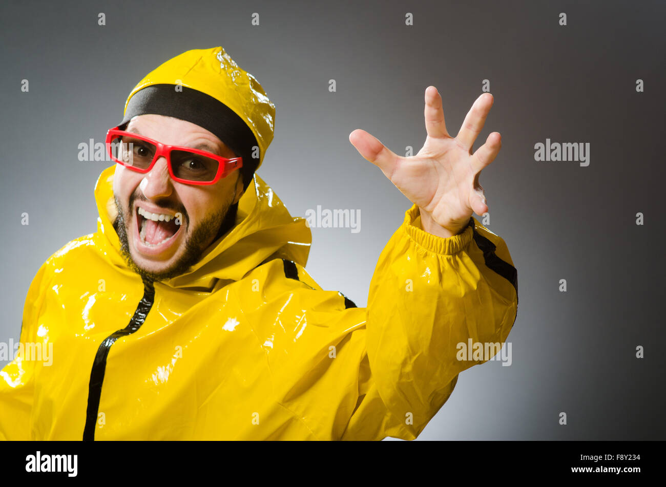 Funny man wearing yellow suit Stock Photo Alamy