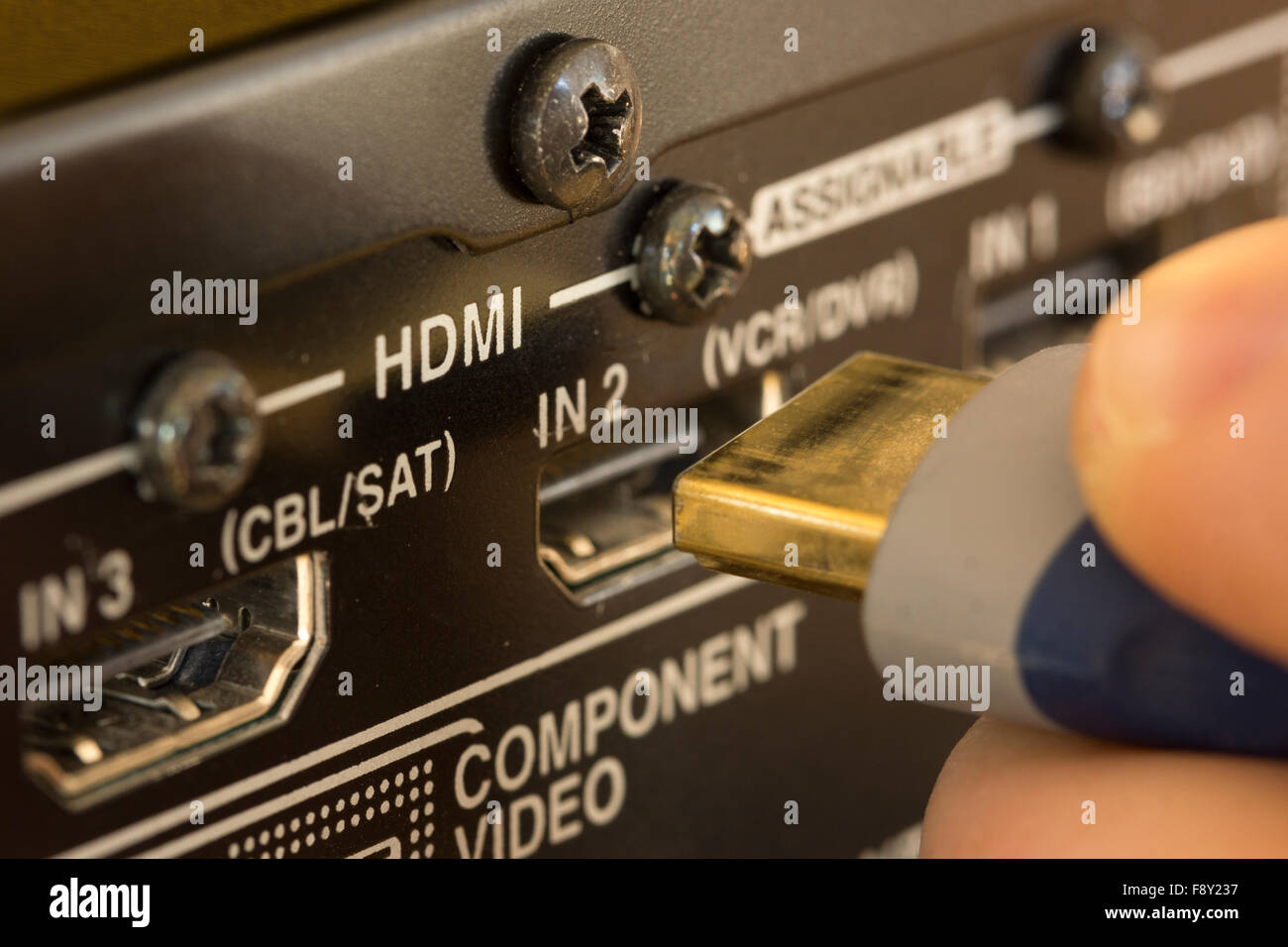A macro shot of plugging in a HDMI cable head Stock Photo Alamy