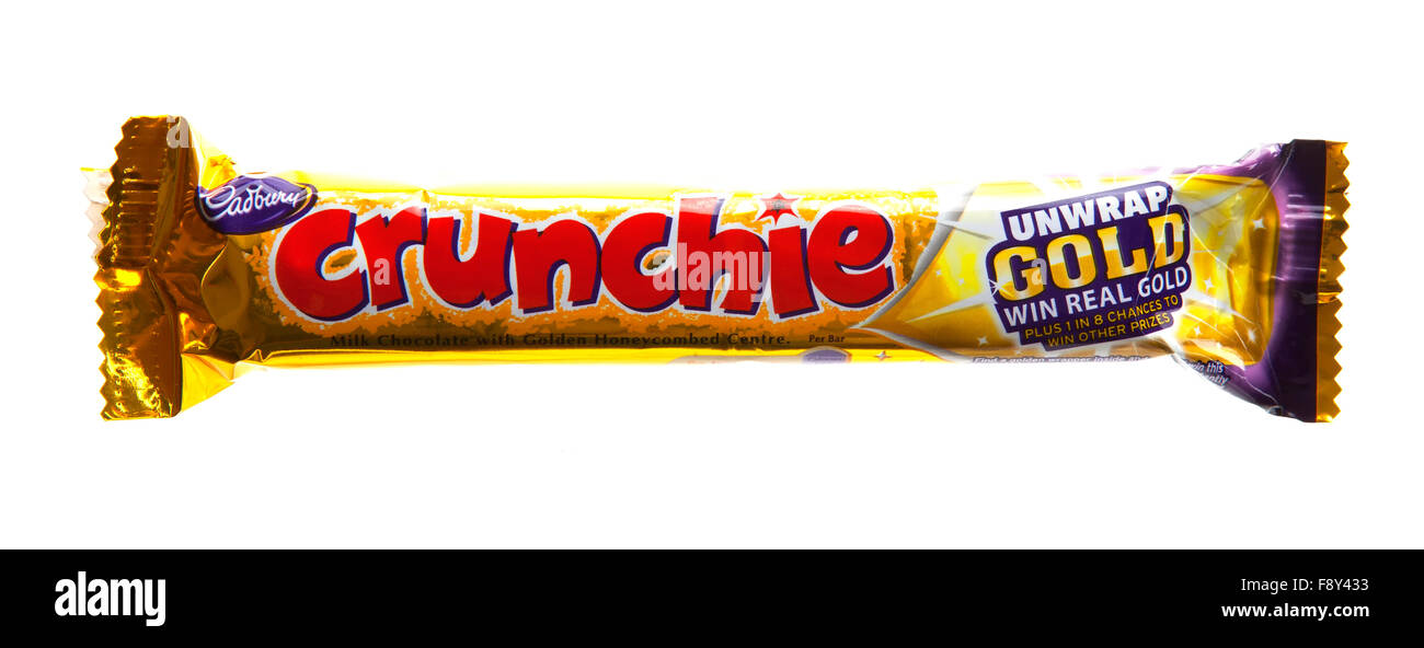 Cadbury's Crunchie Chocolate bar on a white background Stock Photo