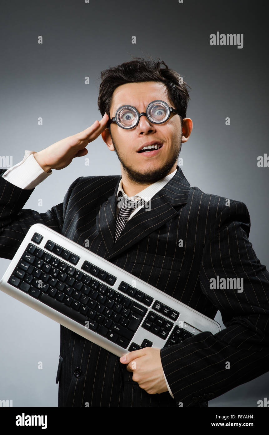 Comouter geek with computer keyboard Stock Photo - Alamy