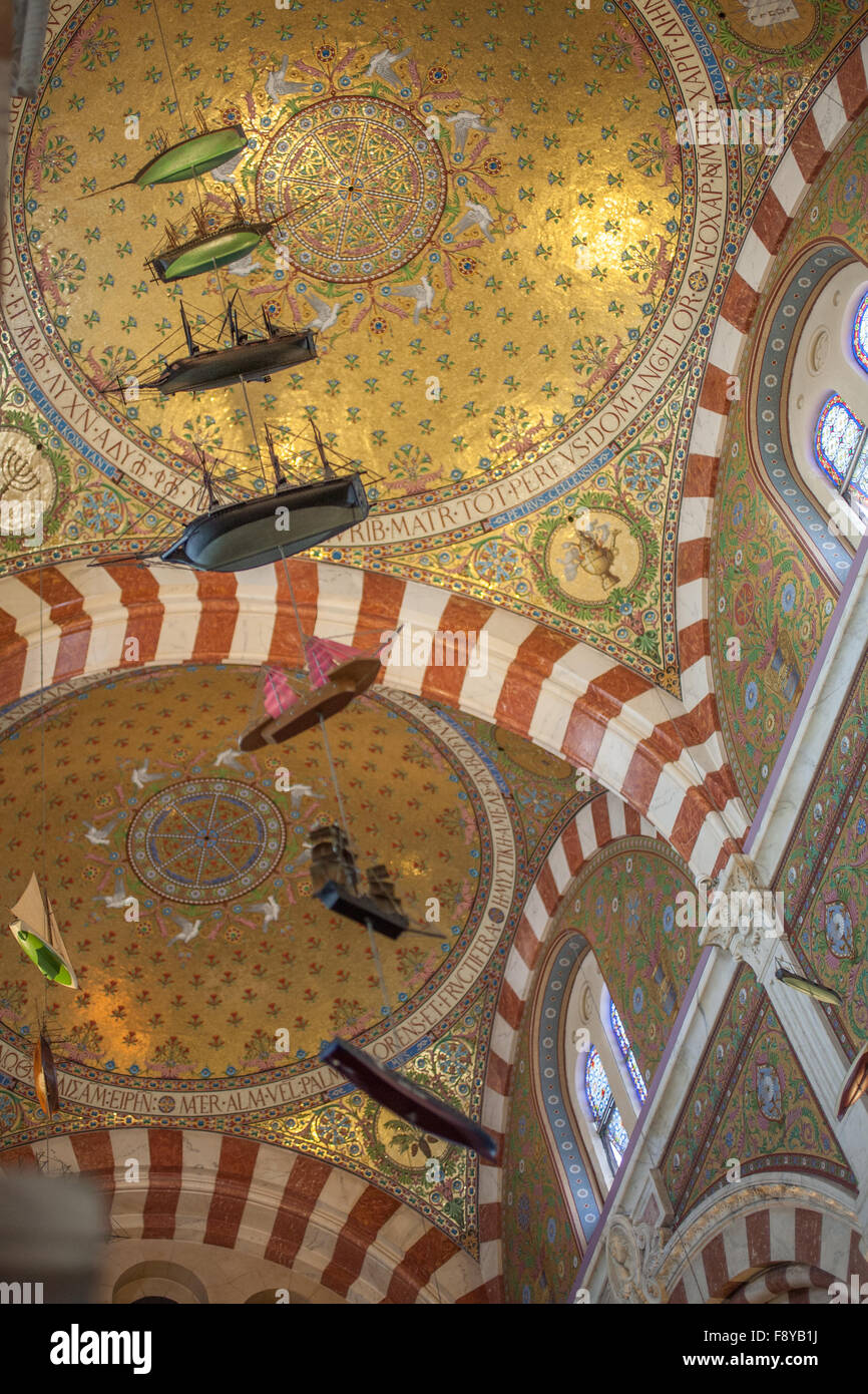 Model ships hanging from ceiling inside Notre Dame De La Garde, Marseille, France Stock Photo
