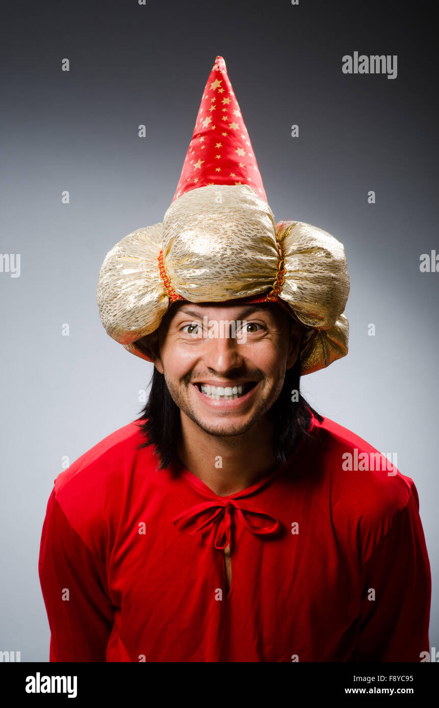 Funny wizard wearing red dress Stock Photo - Alamy