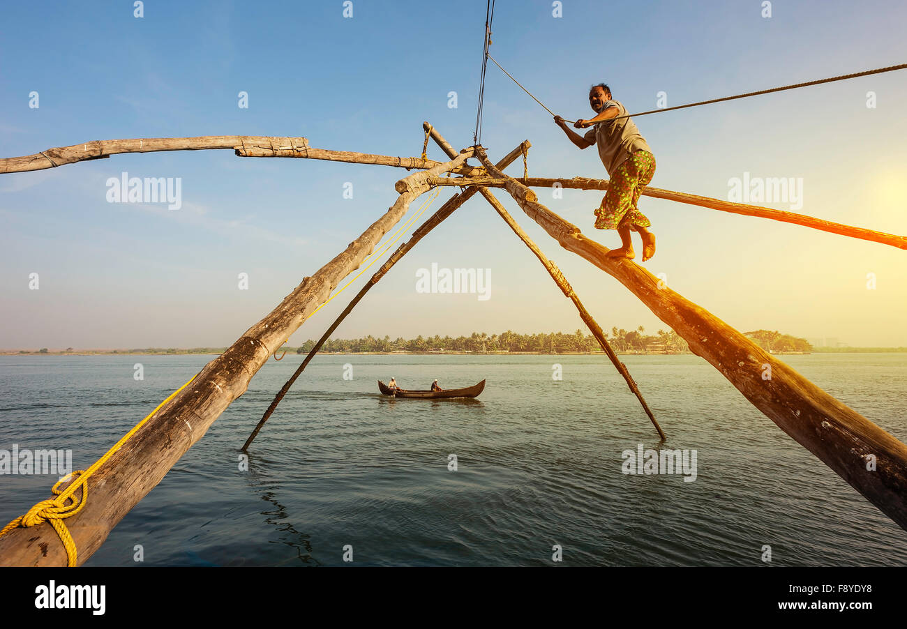 https://c8.alamy.com/comp/F8YDY8/fisherman-operates-a-large-chinese-fishing-net-by-acting-as-cantilever-F8YDY8.jpg