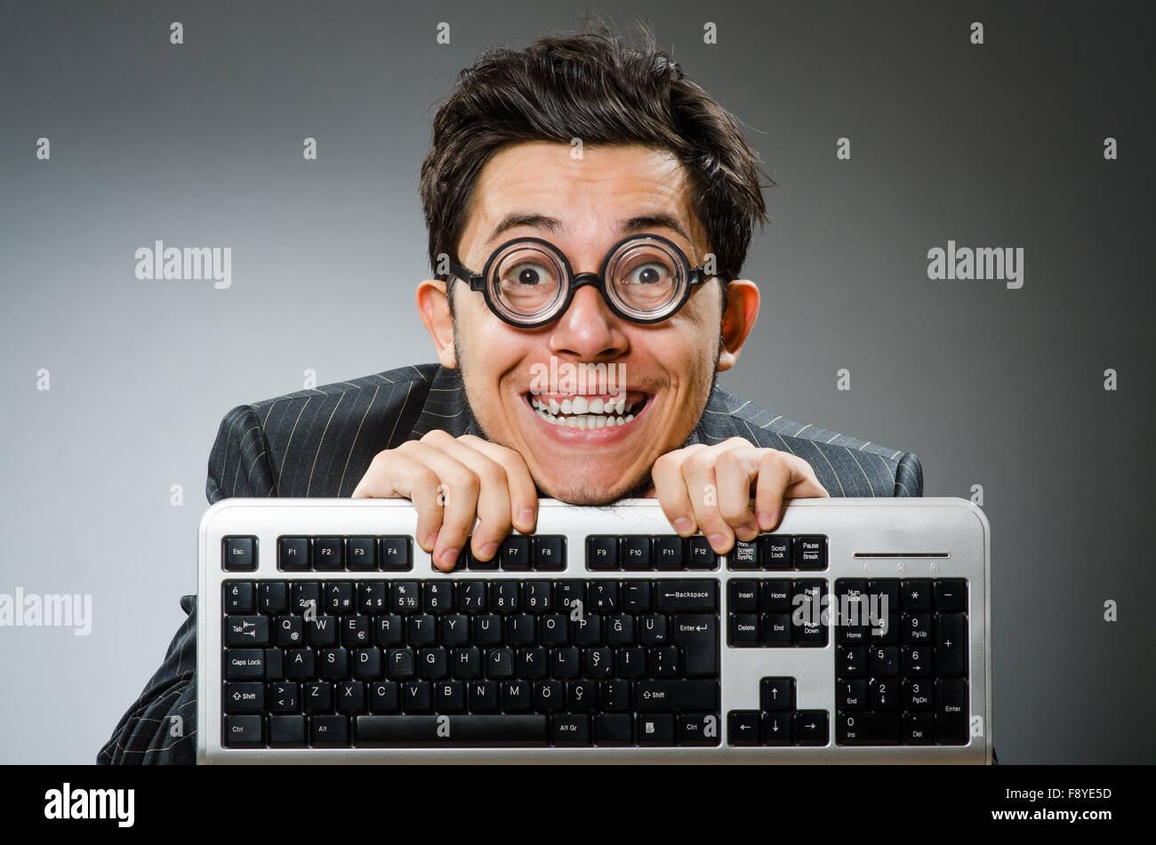 Computer geek with computer keyboard Stock Photo - Alamy