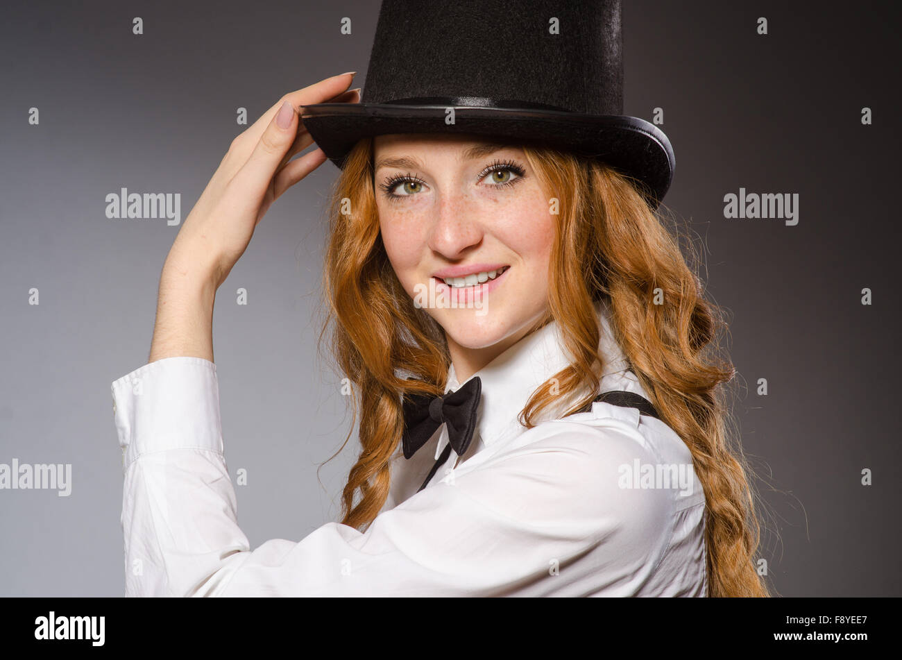 Pretty girl wearing retro hat isolated on gray Stock Photo - Alamy
