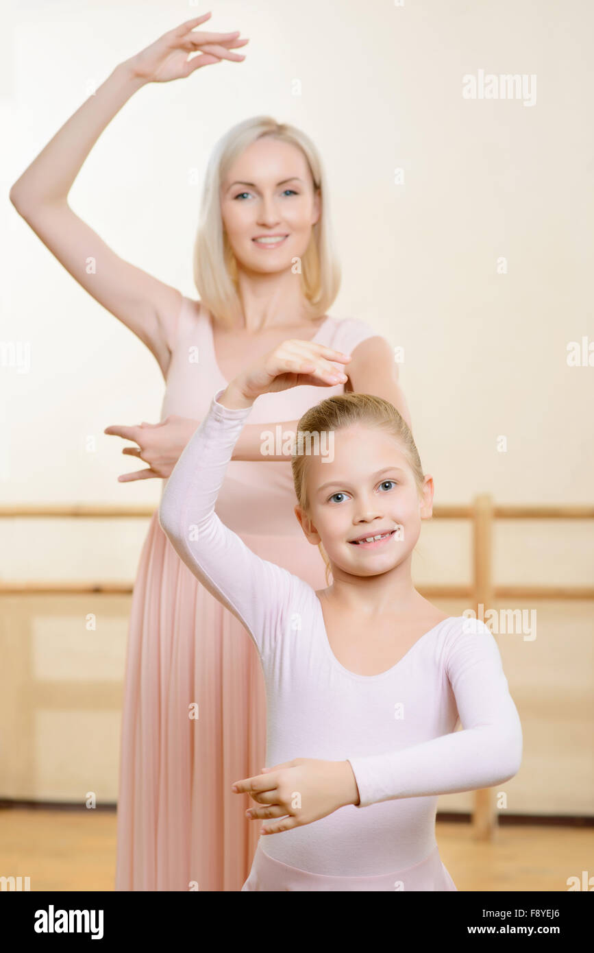 Ballet teacher and her apprentice are holding a pose Stock Photo Alamy