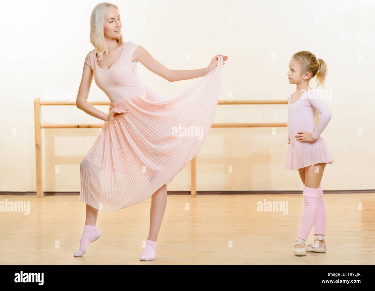 Ballet teacher and her little apprentice in the classroom Stock Photo ...