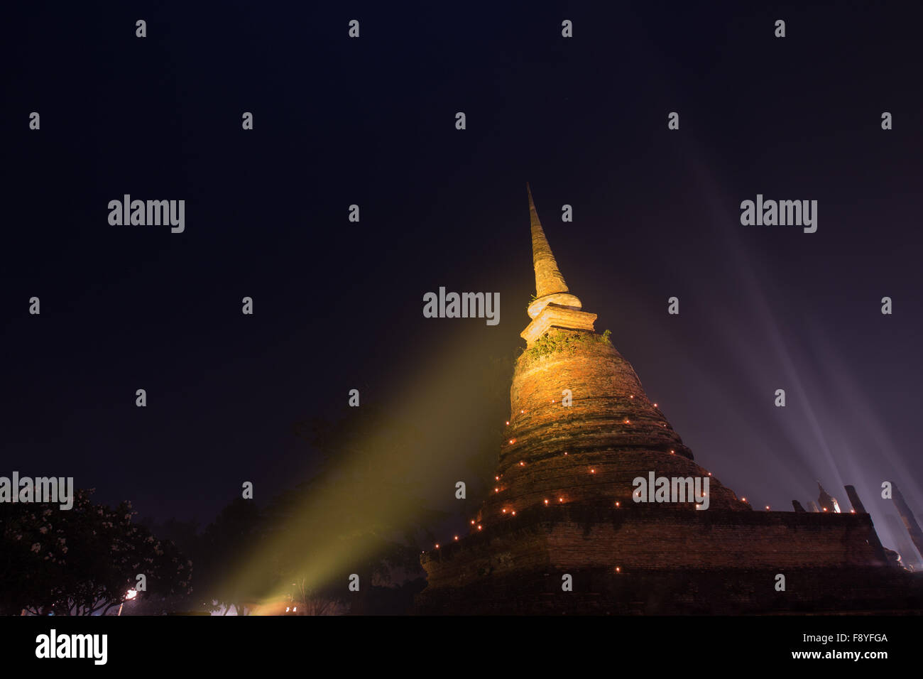 Ancient buddhist temple ruins at night in Sukhothai historical park,Thailand. Stock Photo