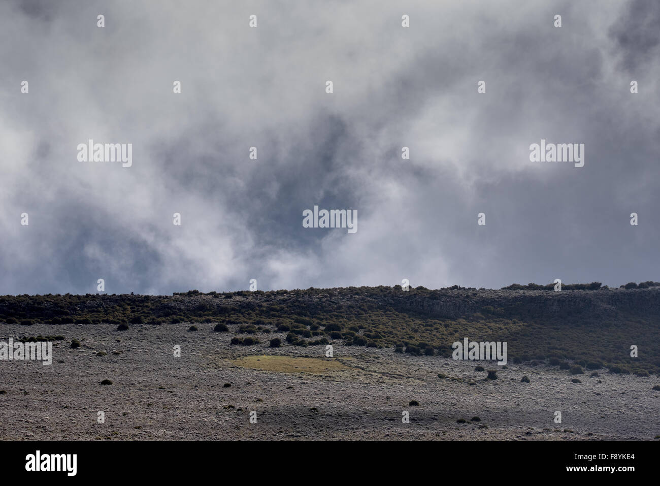 Clouds rising up along the edge of the 3800 metre high grasslands of the Afro-montane Sanetti plateau in Ethiopia Stock Photo