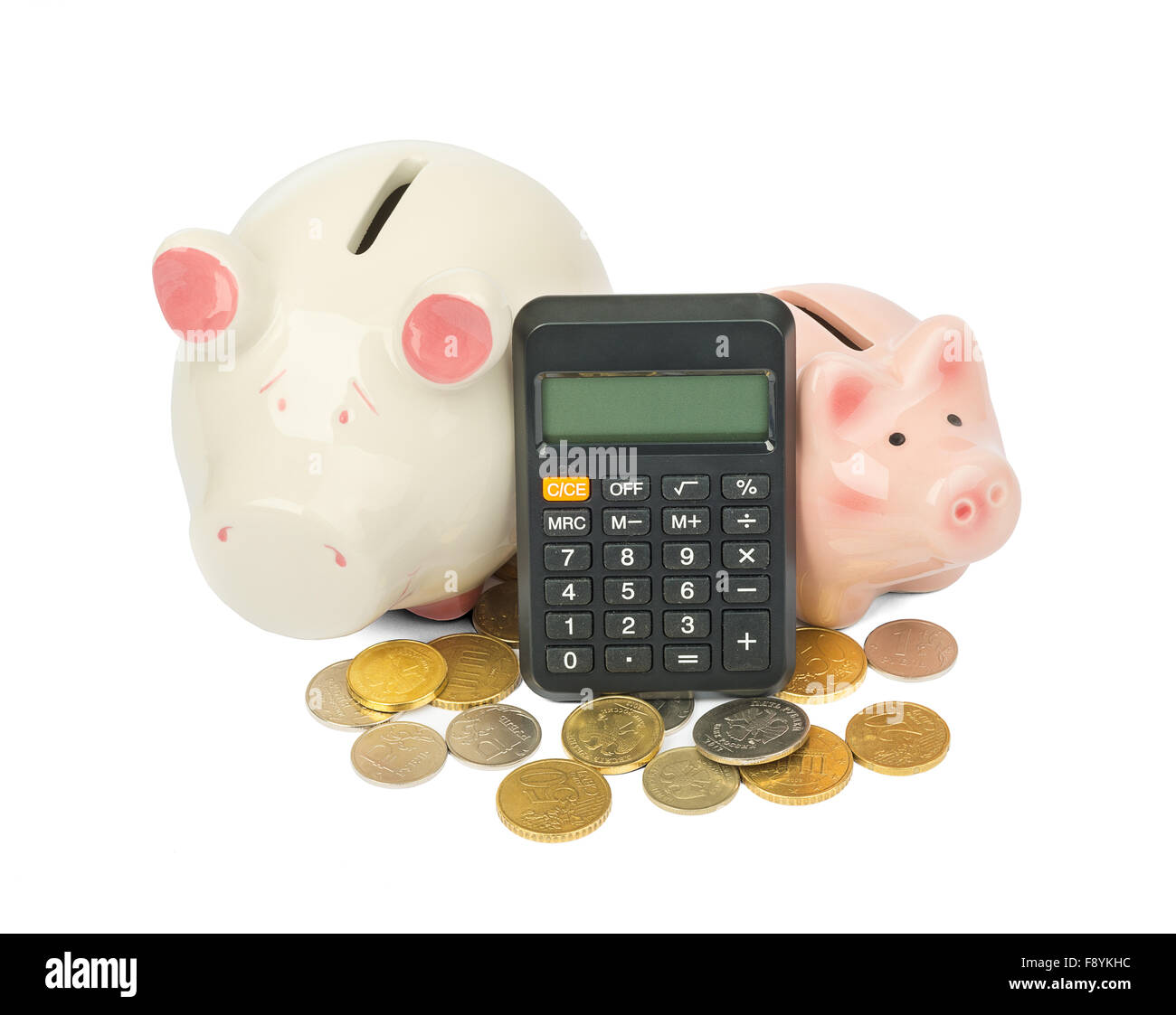 Piggy banks with coins and calculator Stock Photo - Alamy